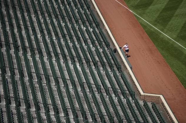 A ballgirl waits as the Baltimore Orioles play the Chicago White Sox at Orioles Park at Camden Yards, in Baltimore, Maryland on April 29, 2015. For the first time in Major League Baseball s history fans were not allowed to the game because of the ongoing civil unrest and protest in Baltimore in the wake of Freddie Gray s death. The late 25-year-old died earlier this month from a spinal injury while in police custody.  BAL20150429320 KEVINxDIETSCH