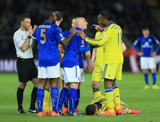 Chelsea s Didier Drogba complains to referee Mark Clattenburg about Leicester s esteban Cambisso s tackle on Eden Hazard Barclays Premier League - Leicester City vs Chelsea - King Power Stadium - England - 26th April 2015 - Picture David Klein Sportimage EDITORIAL USE ONLY. No use with unauthorised audio, video, data, fixture lists, club league logos or live services. Online in-match use limited to 120 images, no video emulation. No use in betting, games or single club league player publications.