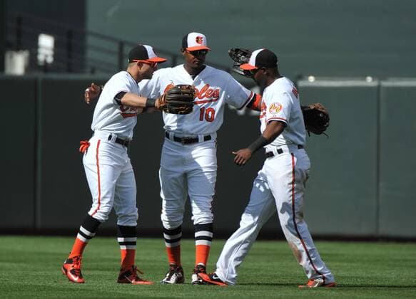 Baltimore Orioles outfielders Adam Jones (10) Delmon Young (R) and Alejandro De Aza hug after the Orioles 8-2 win over the Chicago White Sox at Orioles Park at Camden Yards in Baltimore, Maryland on April 29, 2015. For the first time in Major League Baseball s history fans were not allowed to the game because of the ongoing civil unrest and protest in Baltimore in the wake of Freddie Gray s death. The late 25-year-old died earlier this month from a spinal injury while in police custody.  BAL20150429329 KEVINxDIETSCH