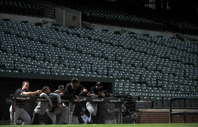 Members of the Chicago White Sox are seen in the dugout as they play the Baltimore Orioles at Orioles Park at Camden Yards in Baltimore, Maryland on April 29, 2015. For the first time in Major League Baseball s history fans were not allowed to the game because of the ongoing civil unrest and protest in Baltimore in the wake of Freddie Gray s death. The late 25-year-old died earlier this month from a spinal injury while in police custody.  BAL20150429331 KEVINxDIETSCH