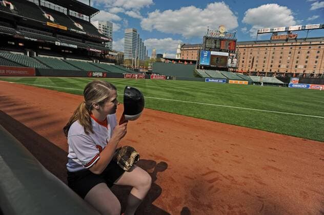 April 29, 2015 - Baltimore, MD, USA - Baltimore Orioles ball girl Emily Potere has no fans to give foul balls to during the team s game against the Chicago White Sox game on Wednesday, April 29, 2015, at Camden Yards in Baltimore. The game was closed to the public due to unrest in the city this week. MLB Baseball Herren USA 2015 - Baltimore Orioles Play In Empty Camden Yards - ZUMAm67_
