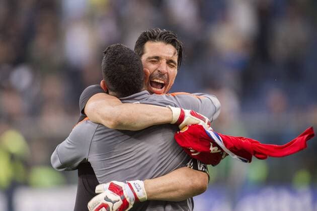 Gianluigi Buffon, Carlos Tevez (Juventus), MAY 2, 2015 - Football Soccer : Gianluigi Buffon and Carlos Tevez of Juventus celebrate after winning the Italian Serie A match between Sampdoria 0-1 Juventus at Stadio Comunale Luigi Ferraris in Genova, Italy. Juventus clinched fourth successive Serie A title. NOxTHIRDxPARTYxSALES.  (ptmb074508)