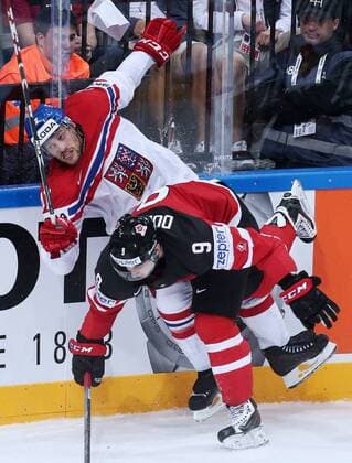 PRAGUE, CZECH REPUBLIC. MAY 4, 2015. Czech Republic s Petr Koukal (L) and Canada s Matt Duchene fight for the puck in their 2015 IIHF World Championshiop Preliminary Round Group A Ice hockey Eishockey match at O2 Arena. The Canadian team won the game 6:3. Yelena Rusko TASS  TS001B28