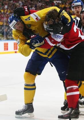Ice hockey Eishockey - IIHF Ice Hockey WC 2015 PRAGUE,CZECH REPUBLIC,06.MAY.15 - ICE HOCKEY - IIHF World Ice Hockey Championships, international match Länderspiel Sweden vs Canada. Image shows Staffan Kronwall (SWE) and Nathan Mackinnon (CAN). Keywords: fight. GEPAxpictures xAndreasxPranter 