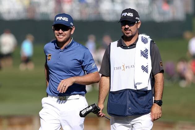 May 7, 2015 - Ponte Vedra Beach, Florida, United States - Louis Oosthuizen (L) and his caddie walk off the 7th green during the first round of THE PLAYERS Championship. THE PLAYERS Championship - Round 1 - ZUMAw109