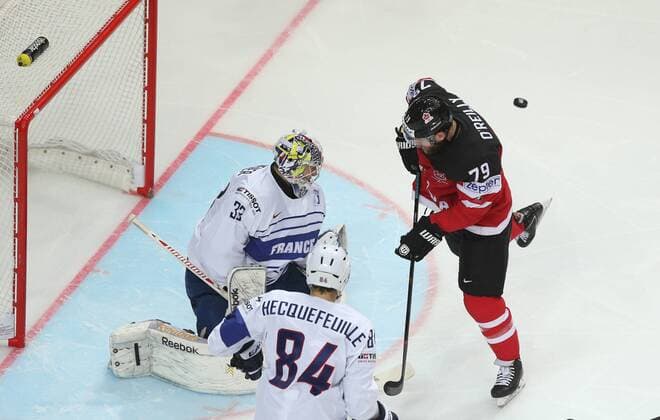 Ice hockey Eishockey - IIHF Ice Hockey WC 2015 PRAGUE,CZECH REPUBLIC,09.MAY.15 - ICE HOCKEY - IIHF World Ice Hockey Championships, international match Länderspiel France vs Canada. Image shows Ronan Quemener, Kevin Hecquefeuille (FRA) and Ryan O Reilly (CAN). GEPAxpictures xAndreasxPranter 