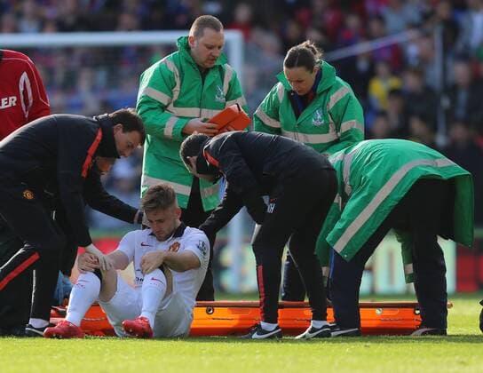 09.05.2015. London, England. Barclays Premier League. Crystal Palace versus Manchester United ManU Luke Shaw is inured and taken off by the medical staff xJasonxHearnx  ActionPlus11619402