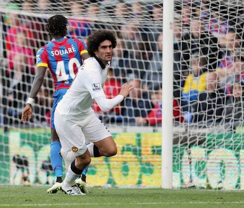 Manchester United ManU s Marouane Fellaini celebrates scoring his sides second goal as fans invade the pitch Barclays Premier League - Crystal Palace vs Manchester United- Selhurst Park - England - 9th May 2015 - Picture David Klein Sportimage EDITORIAL USE ONLY. No use with unauthorised audio, video, data, fixture lists, club league logos or live services. Online in-match use limited to 120 images, no video emulation. No use in betting, games or single club league player publications.