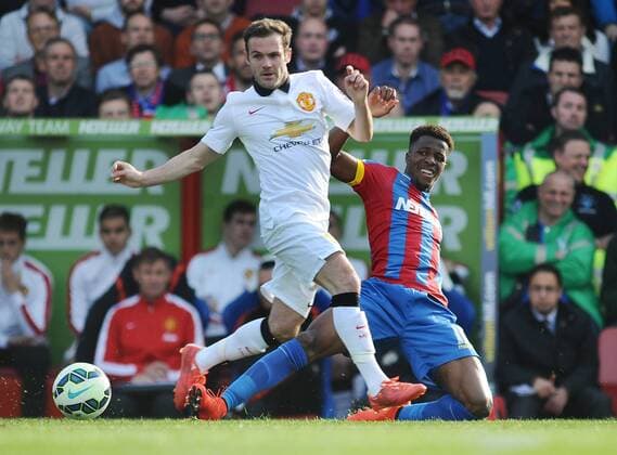Football - 2014 2015 Premier League - Crystal Palace vs. Manchester United ManU Juan Mata of Man Utd and Wilfried Zaha at Selhurst Park. COLORSPORT ANDREW COWIE 