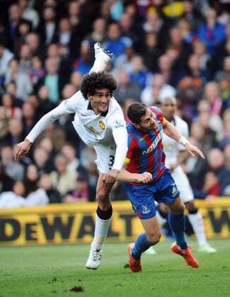 Football - 2014 2015 Premier League - Crystal Palace vs. Manchester United ManU Marouane Fellaini of Man Utd out jumps Joel Ward at Selhurst Park. COLORSPORT ANDREW COWIE 
