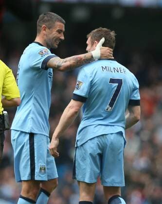 Aleksander Kolarov of Manchester City celebrates scoring the second goal with James Milner of Manchester City - Barclays Premier League - Manchester City vs QPR - Etihad Stadium - Manchester - England - 10th May 2015 - Picture Simon Bellis Sportimage EDITORIAL USE ONLY. No use with unauthorised audio, video, data, fixture lists, club league logos or live services. Online in-match use limited to 120 images, no video emulation. No use in betting, games or single club league player publications.