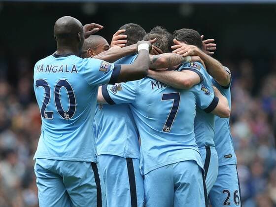 Aleksander Kolarov of Manchester City is swamped as he celebrates scoring the second goal- Barclays Premier League - Manchester City vs QPR - Etihad Stadium - Manchester - England - 10th May 2015 - Picture Simon Bellis Sportimage EDITORIAL USE ONLY. No use with unauthorised audio, video, data, fixture lists, club league logos or live services. Online in-match use limited to 120 images, no video emulation. No use in betting, games or single club league player publications.