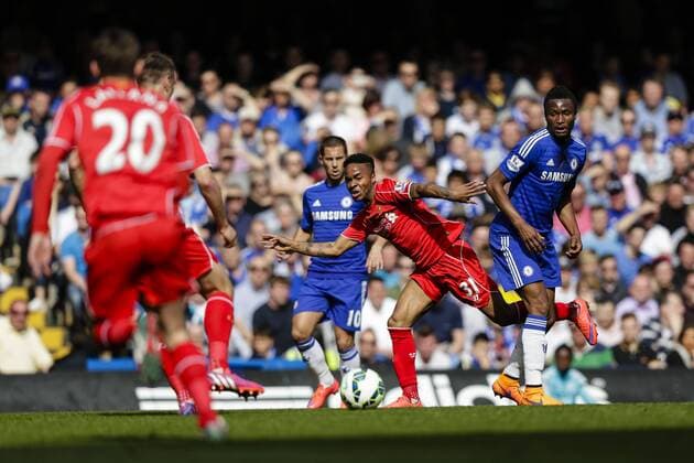 10.05.2015. London, England. Barclays Premier League. Chelsea versus Liverpool. Liverpool& x2019;s Raheem Sterling muscles his way past Chelsea s John Mikel Obi xCraigxMercerx  ActionPlus11619840