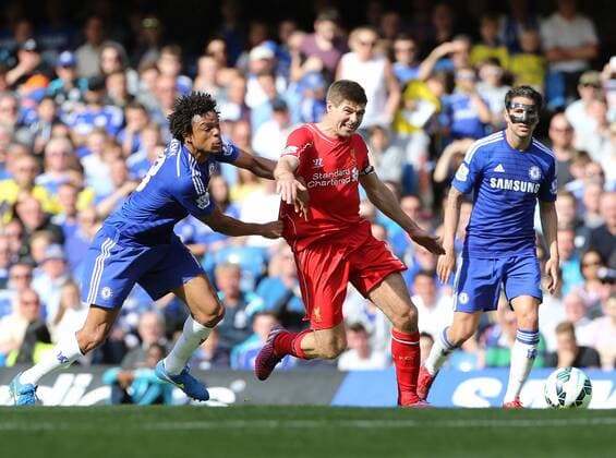 Chelsea s Loic Remy tussles with Liverpool s Steven Gerrard Barclays Premier League - Chelsea vs Liverpool- Stamford Bridge - England - 10th May 2015 - Picture David Klein Sportimage EDITORIAL USE ONLY. No use with unauthorised audio, video, data, fixture lists, club league logos or live services. Online in-match use limited to 120 images, no video emulation. No use in betting, games or single club league player publications.