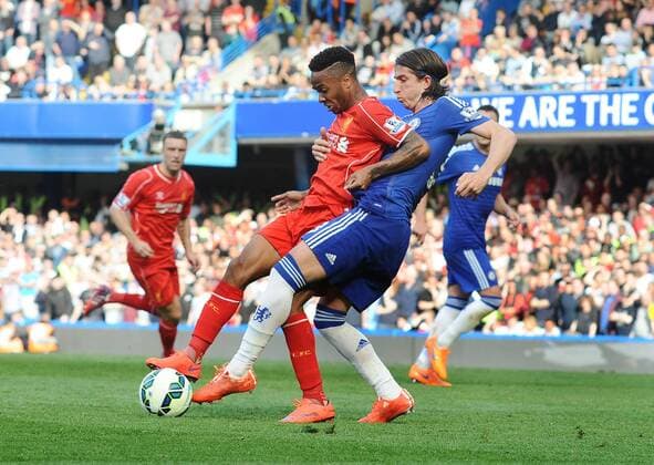Football - 2014 2015 Premier League - Chelsea vs. Liverpool Raheem Sterling of Liverpool and Filipe Luis of Chelsea at Stamford Bridge. COLORSPORT ANDREW COWIE 