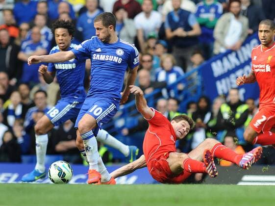 Football - 2014 2015 Premier League - Chelsea vs. Liverpool Eden Hazard of Chelsea Steven Gerrard of Liverpool at Stamford Bridge. COLORSPORT ANDREW COWIE 