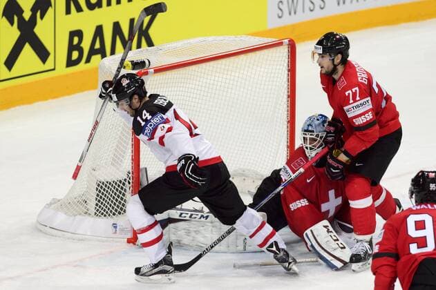 Jordan Eberle (CAN) celebrates a goal; pictured from left: goalkeeper Reto Berra (SUI), Robin Grossmann (SUI) and Julian Walker (SUI) in action during the Ice hockey Eishockey World Championship WM Weltmeisterschaft Group A match Switzerland vs Canada in Prague, Czech Republic, May 10, 2015. (CTKxPhoto MichalxKamaryt) CTKPhotoP201505100659701  kmt 6