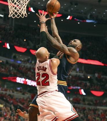 May 10, 2015 - Chicago, IL, USA - Cleveland Cavaliers forward LeBron James (23) goes to the basket against Chicago Bulls forward Taj Gibson (22) during the third quarter on Sunday, May 10, 2015, at the United Center in Chicago. Cleveland Cavaliers at Chicago Bulls - ZUMAm67_