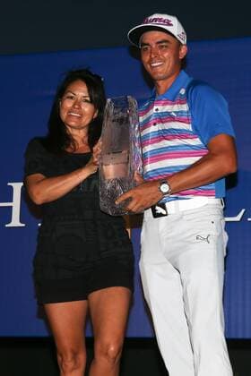 May 10, 2015 - Ponte Vedra Beach, Florida, United States - Lynn Fowler (L) and Rickie Fowler hold the trophy after the final round of THE PLAYERS Championship. THE PLAYERS Championship - Final Round - ZUMAw109