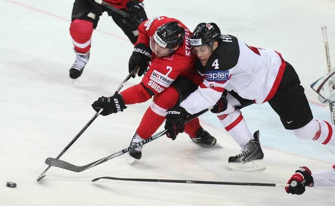 PRAGUE, CZECH REPUBLIC. MAY 10, 2015. Switzerland s Mark Streit (L) and Canada s Taylor Hall fight for the puck in their 2015 IIHF World Championship WM Weltmeisterschaft Preliminary Round Group A Ice hockey Eishockey match at O2 Arena. The Canadian team won the game 7:2. Yelena Rusko TASS  TS0022E7
