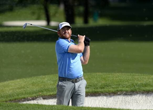 May 13, 2015 - Charlotte, NC, USA - Golf - - 2014 Wells Fargo champion J.B. Holmes watches his shot from a sand trap along the 16th fairway during the Pro-Am on Wednesday, May 13, 2015, at Quail Hollow Club in Charlotte, N.C. Wells Fargo Pro-Am round - ZUMAm67_