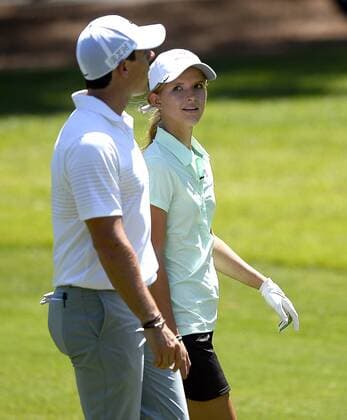 May 13, 2015 - Charlotte, NC, USA - Grace Vaughan, right, glances over at golfer Rory McIlroy, left, as they walk to the fourth green during the Pro-Am on Wednesday, May 13, 2015, at Quail Hollow Club in Charlotte, N.C. Vaughan, from Spartanburg, S.C., was the winner of an essay contest and was part of McIlroy s team during the Pro-Am. Wells Fargo Pro-Am round - ZUMAm67_