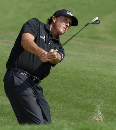 May 15, 2015 - Charlotte, NC, USA - Phil Mickelson chips his ball onto the 14th green during the second round of the Wells Fargo Championship at Quail Hollow Club on Friday, May 15, 2015, in Charlotte, N.C. Wells Fargo Second Round - ZUMAm67_