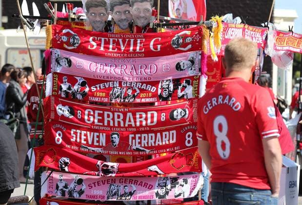A Liverpool fan in a Steven Gerrard shirt takes a look at the Gerrard branded scarves - Barclays Premier League - Liverpool vs Crystal Palace - Anfield Stadium - Liverpool - England - 16th May 2015 - Picture Simon Bellis Sportimage EDITORIAL USE ONLY. No use with unauthorised audio, video, data, fixture lists, club league logos or live services. Online in-match use limited to 120 images, no video emulation. No use in betting, games or single club league player publications.