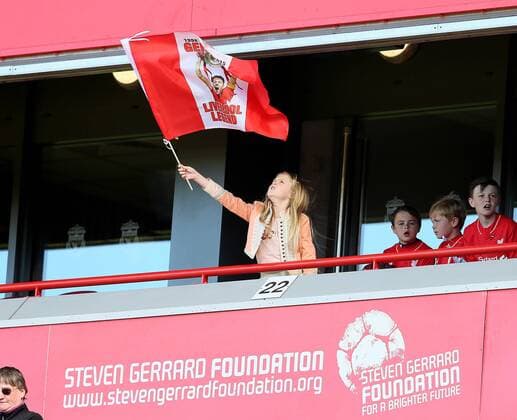 Flying the flag for Dad as Lexie Gerrard waves a Steven Gerrard flag before kick off - Barclays Premier League - Liverpool vs Crystal Palace - Anfield Stadium - Liverpool - England - 16th May 2015 - Picture Simon Bellis Sportimage EDITORIAL USE ONLY. No use with unauthorised audio, video, data, fixture lists, club league logos or live services. Online in-match use limited to 120 images, no video emulation. No use in betting, games or single club league player publications.