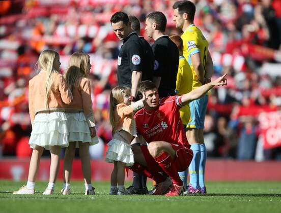 Steven Gerrard takes to field with his daughters in his last game at Anfield and then has to point out to his youngest daughter where her mum is - Barclays Premier League - Liverpool vs Crystal Palace - Anfield Stadium - Liverpool - England - 16th May 2015 - Picture Simon Bellis Sportimage EDITORIAL USE ONLY. No use with unauthorised audio, video, data, fixture lists, club league logos or live services. Online in-match use limited to 120 images, no video emulation. No use in betting, games or single club league player publications.