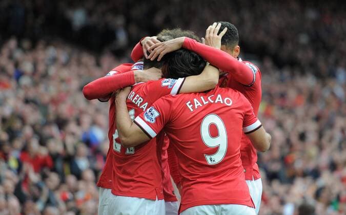 Football - 2014 2015 Premier League - Manchester United ManU vs. Arsenal Ander Herrera of Manchester United celebrates scoring the first goal of the game with his team mates at Old Trafford, Manchester 