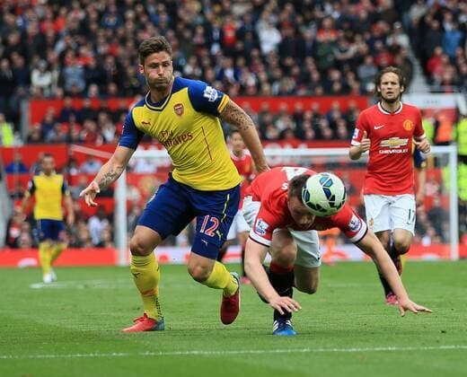 Manchester United ManU s Phil Jones heads the ball off Arsenal s Olivier Giroud s boot Barclays Premier League - Manchester United vs Arsenal - Old Trafford - England - 17th May 2015 - Picture David Klein Sportimage EDITORIAL USE ONLY. No use with unauthorised audio, video, data, fixture lists, club league logos or live services. Online in-match use limited to 120 images, no video emulation. No use in betting, games or single club league player publications.