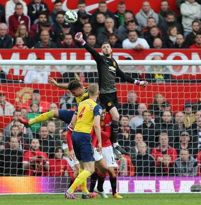 Manchester United ManU s David De Gea saves from Arsenal s Olivier Giroud Barclays Premier League - Manchester United vs Arsenal - Old Trafford - England - 17th May 2015 - Picture David Klein Sportimage EDITORIAL USE ONLY. No use with unauthorised audio, video, data, fixture lists, club league logos or live services. Online in-match use limited to 120 images, no video emulation. No use in betting, games or single club league player publications.