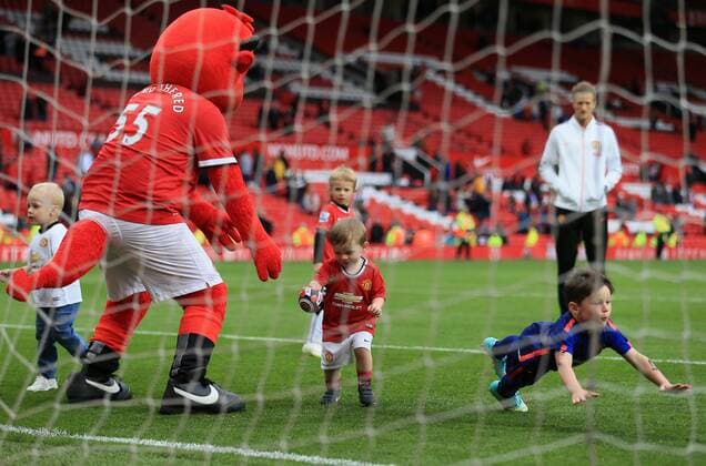Manchester United ManU s mascot Fred the Red plays with Kai and Klay Rooney Barclays Premier League - Manchester United vs Arsenal - Old Trafford - England - 17th May 2015 - Picture David Klein Sportimage EDITORIAL USE ONLY. No use with unauthorised audio, video, data, fixture lists, club league logos or live services. Online in-match use limited to 120 images, no video emulation. No use in betting, games or single club league player publications.
