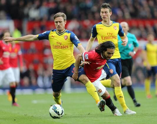 Manchester United ManU s Radamel Falcao tussles with Arsenal s Nacho Monreal Barclays Premier League - Manchester United vs Arsenal - Old Trafford - England - 17th May 2015 - Picture David Klein Sportimage EDITORIAL USE ONLY. No use with unauthorised audio, video, data, fixture lists, club league logos or live services. Online in-match use limited to 120 images, no video emulation. No use in betting, games or single club league player publications.