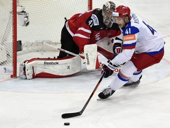 From left Canadian goalkeeper Mike Smith and Russian Nikolai Kulyomin in action during the Ice hockey Eishockey World Championships final duel for gold medal Canada vs Russia in Prague, Czech Republic, May 17, 2015. (CTKxPhoto RomanxVondrous) CTKPhotoP201505170625001  vnd 3