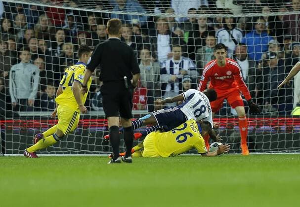 John Terry upends Saido Berahino to concede a penalty at the start of the second half - Football - Barclays Premier League - West Bromwich Albion vs Chelsea - The Hawthorns West Bromwich - Season 2014 2015 - 18th May 2015 - Photo Malcolm Couzens Sportimage EDITORIAL USE ONLY. No use with unauthorised audio, video, data, fixture lists, club league logos or live services. Online in-match use limited to 120 images, no video emulation. No use in betting, games or single club league player publications.
