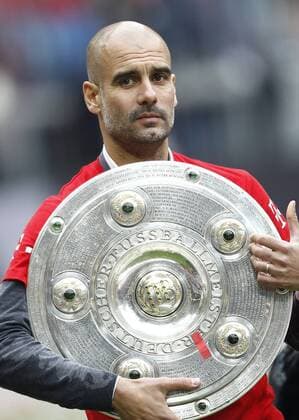 SOCCER - 1. DFL, Bayern vs Mainz MUNICH,GERMANY,23.MAY.15 - SOCCER - 1. DFL, 1. Deutsche Bundesliga, FC Bayern Muenchen vs 1. FSV Mainz 05. Image shows head coach Pep Guardiola (Bayern). Keywords: trophy. GEPA xFelixxRoittner
