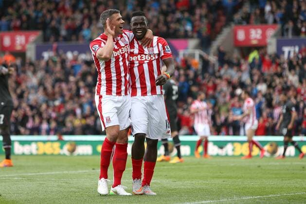 StokeâÄ?s Mame Biram Diouf celebrates his opening goal with Jon Walters - Stoke City vs. Liverpool - Barclay s Premier League - Britannia Stadium - Stoke - 24 05 2015 Pic Philip Oldham Sportimage EDITORIAL USE ONLY. No use with unauthorised audio, video, data, fixture lists, club league logos or live services. Online in-match use limited to 120 images, no video emulation. No use in betting, games or single club league player publications.