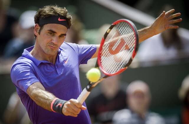 (150524) -- PARIS, May 24, 2015 -- Roger Federer of Switzerland returns a shot during the men s singles first round match against Alejandro Falla of Colombia at Roland Garros, Paris, France on May 24, 2015. Roger Federer won 3-0 and advanced to the second round. ) (SP)FRANCE-PARIS-TENNIS-ROLAND GARROS-FIRST ROUND chenxxiaowei 