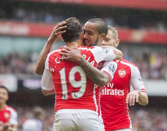 24.05.2015. London, England. Barclays Premier League. Arsenal versus West Bromwich Albion. Arsenal s Theo Walcott and Santi Cazorla celebrate their sides fourth goal xNigelxCookex  ActionPlus11623665