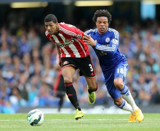 Chelsea s Loic Remy tussles with Sunderland s Patrick Van Aanholt Barclays Premier League - Chelsea vs Sunderland - Stamford Bridge - England - 24th May 2015 - Picture David Klein Sportimage EDITORIAL USE ONLY. No use with unauthorised audio, video, data, fixture lists, club league logos or live services. Online in-match use limited to 120 images, no video emulation. No use in betting, games or single club league player publications.