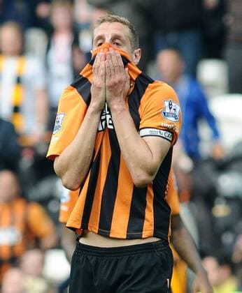 Football - 2014 2015 Premier League - Hull City vs. Manchester United ManU A distraught Michael Dawson of Hull City at the final whistle after being relegated at KC Stadium. COLOSPORT ANDREW COWIE 