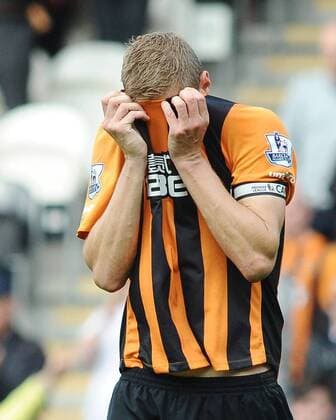 Football - 2014 2015 Premier League - Hull City vs. Manchester United ManU A distraught Michael Dawson of Hull City at the final whistle after being relegated at KC Stadium. COLOSPORT ANDREW COWIE 