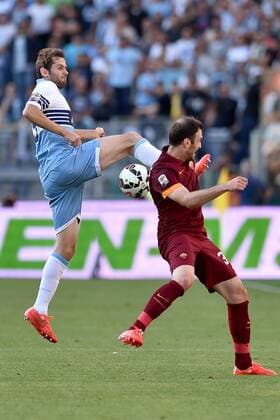 Aktuell FuÃŸball, Italien, Serie A, Lazio Rom - AS Rom 25.05.2015. Rome, Italy. Serie A Football. Lazio - AS Roma. Senad Lulic challenges Vasilis Torosidis xGiuseppexMaffiax  ActionPlus11624283