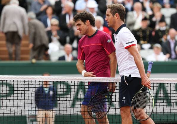 - PARIS, FRANCE: Belgian Germain Gigounon and French Richard Gasquet shake hands at the end of the first round game of the women s singles tournament at the Roland Garros tennis tournament, between Belgian Alison Van Uytvanck and Slovakia s Anna Karolina Schmiedlova, in Paris, France, Tuesday 26 May 2015. Roland Garros Grand Slam takes place from 24 May to 07 June 2015. Gasquet won 6-3, 6-4, 6-0. VIRGINIExLEFOUR  x04630942x