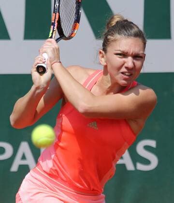 Simona Halep of Romania hits a shot during her French Open women s second round match against Mirjana Lucic-Baroni of Croatia at Roland Garros in Paris on May 27, 2015. Lucic-Baroni defeated Halep 7-5, 6-1 to advance to the next round.  PAR20150527703 DAVIDxSILPA
