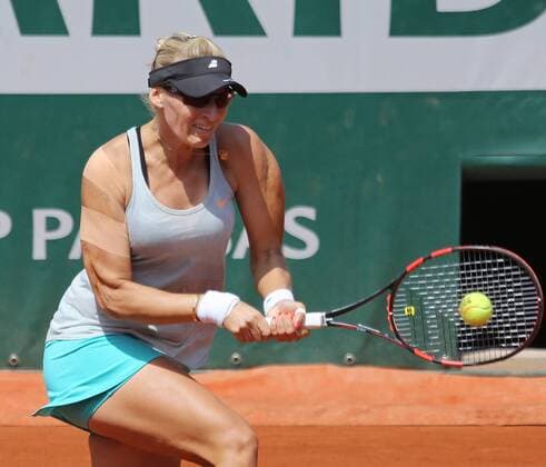 Mirjana Lucic-Baroni of Croatia hits a shot during her French Open women s second round match against Simona Halep of Romania at Roland Garros in Paris on May 27, 2015. Lucic-Baroni defeated Halep 7-5, 6-1 to advance to the next round.  PAR20150527709 DAVIDxSILPA