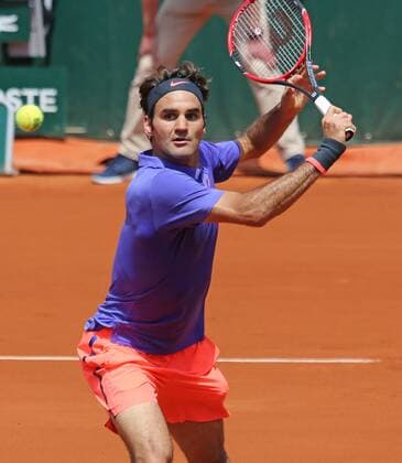 Roger Federer of Switzerland hits a shot during his French Open men s second round match against Marcel Granollers of Spain at Roland Garros in Paris on May 27, 2015. Federer defeated Granollers 6-2, 7-6 (1), 6-3 to advance to the next round.  PAR20150527712 DAVIDxSILPA