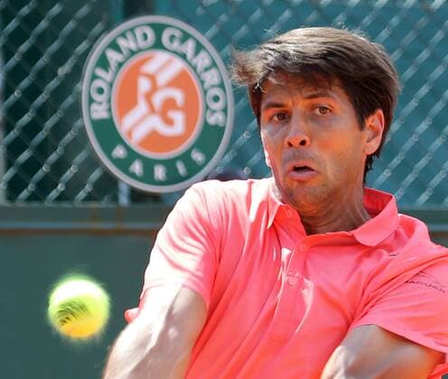 Fernando Verdasco of Spain hits a shot during his French Open men s second round match against Benjamin Becker of Germany at Roland Garros in Paris on May 27, 2015. Becker defeated Verdasco 6-4, 0-6, 1-6, 7-5, 10-8 to advance to the next round.  PAR20150527752 DAVIDxSILPA